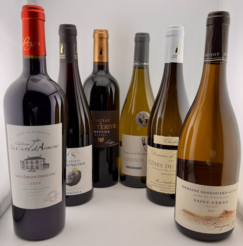 Collection of seasonal autumn wine bottles with various labels on a white background