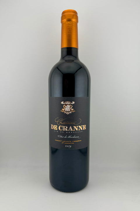 Bottle of 6éme Generation wine from Château de Cranne with a dark label and a golden cap, indicating it is a red wine from Bordeaux.