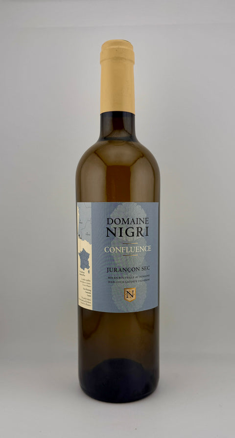Wine bottle with 'Domaine Nigri' label on a gray background, white wine