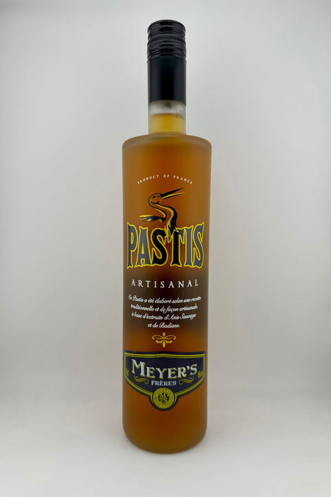 A bottle of Pastis liqueur with a label that includes the brand name 'Meyer' and the text 'Artesanal', indicating it is a traditional French aperitif.