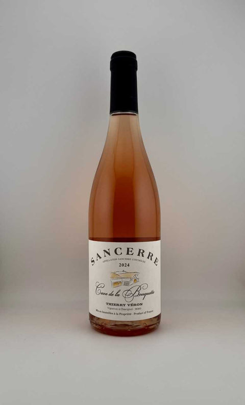 Bottle of Rose Sancerre wine with a white label on a light gray background