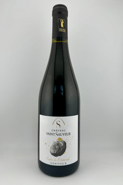 A bottle of Cuvée de L'asteroide wine from Chateau St Sauveur with a label indicating it is an organic wine from the Ventoux region.