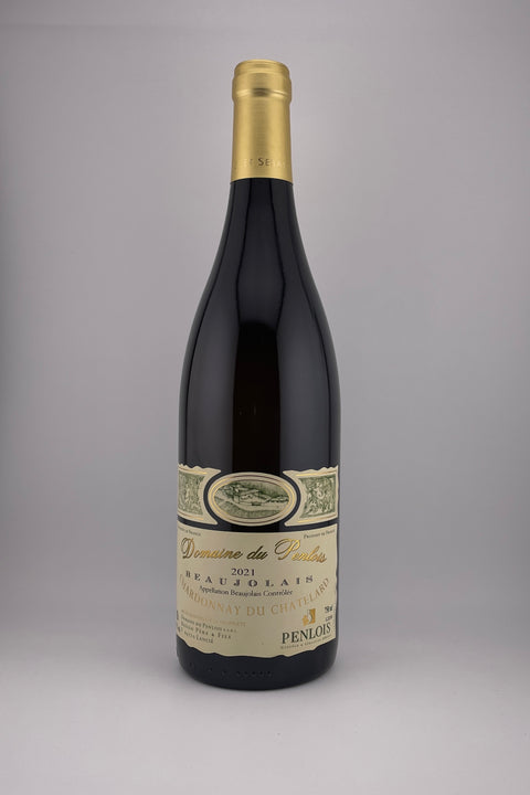 A bottle of Chardonnay du Chatelard, Unoaked, from Domaine Penlois, with a yellow label and a gold foil cap, against a grey background.