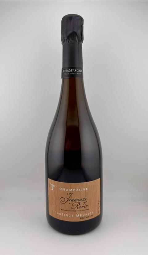 Bottle of champagne with a visible label on a white background