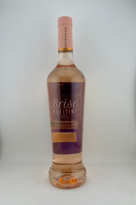 A bottle of Brise Maritime, Domaine Estandon, IGP Méditerranée, 2023 rosé wine with a transparent label and cap, against a white background.