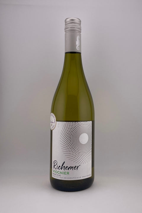A bottle of Viognier wine from Les Caves Richemer with a label that includes the name and the year 2022, white wine.